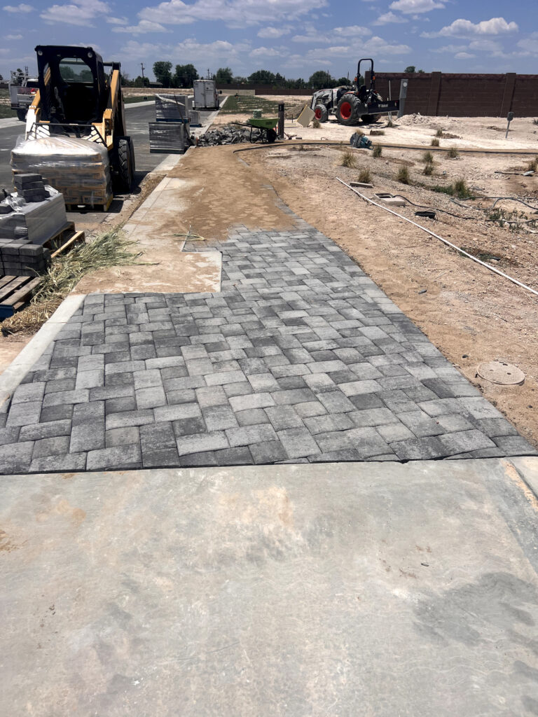 Hardscaping experts from K-Ler Landworks installing a custom stone patio in Cottonwood, AZ near me.