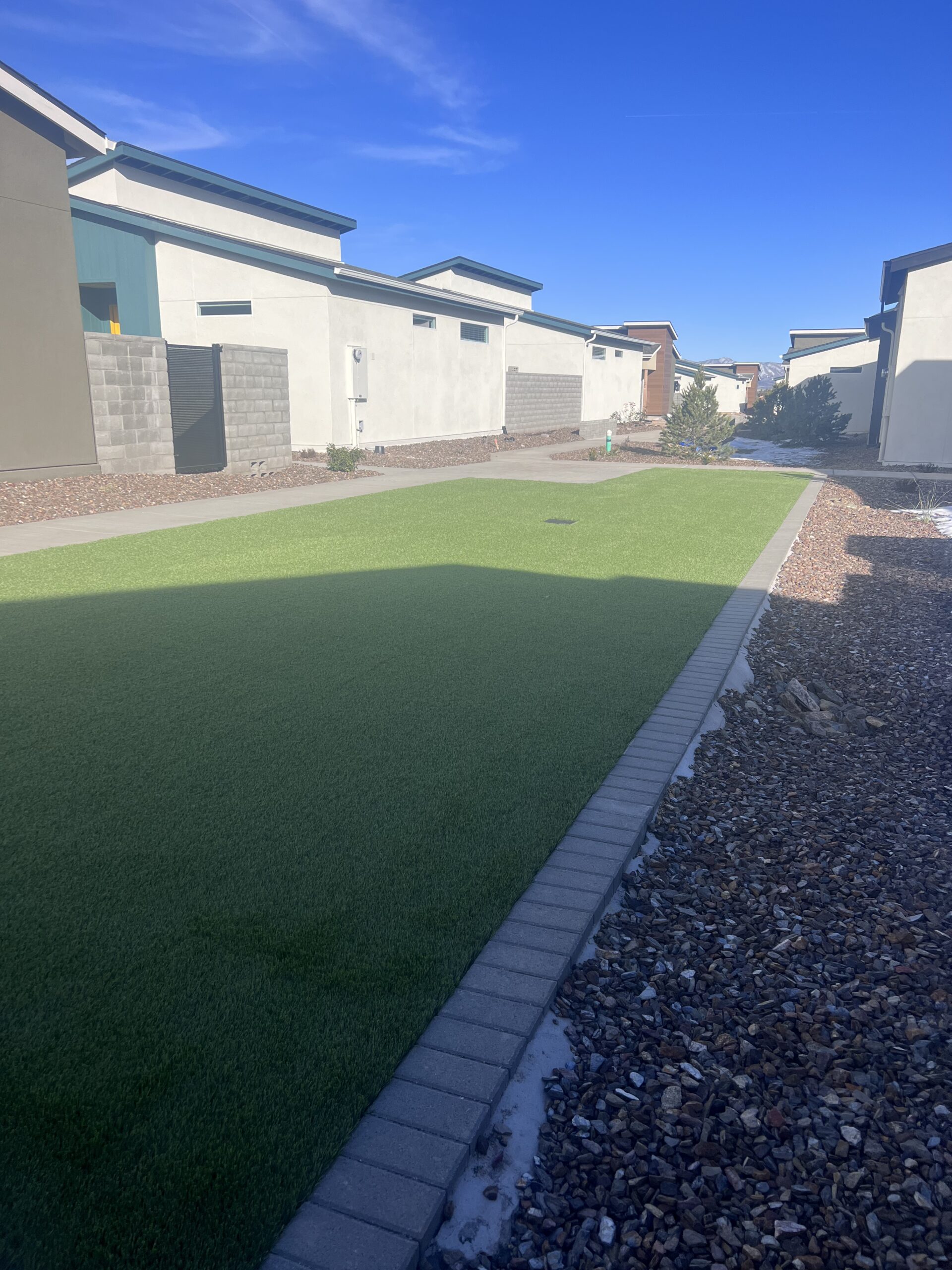 Professional backyard remodel near me in Prescott, AZ including pavers, seating areas, and lighting